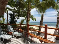 Beach front bure balcony at Beachcomber Island Resort