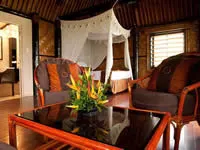 Deluxe seaside bure interior at Crusoe's Retreat