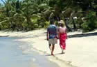 Couple on the beach - First Landing Beach Resort & Villas