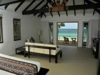 Beachfront bure bedroom - Lomani Island Resort