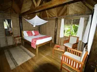 Oceanview bure bedroom at Matava the Astrolabe Hideaway