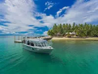 Dive boat at Toberua Island Resort