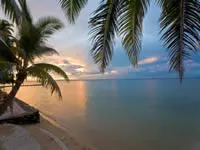 Sunset over beach at Toberua Island Resort